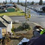 Sequim Gazette photo by Matthew Nash/ Capt. Travis Anderson with Clallam County Fire District 3 steers the bucket of a ladder truck in order to help measure Isobel Johnstons agave plant. It was measured to be about 22 feet tall on Dec. 8.