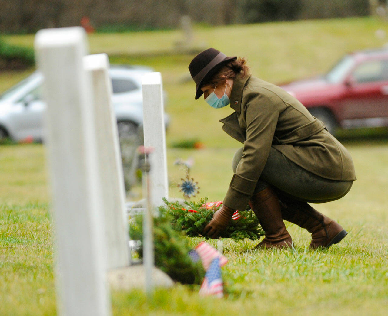 Sequim Gazette file photo by Michael Dashiell / Lance Cpl. Holly Rowan, a U.S. Marine Corps veteran, lays a ceremonial wreath at a Wreaths Across America event at Sequim View Cemetery in 2020.