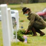 Sequim Gazette file photo by Michael Dashiell / Lance Cpl. Holly Rowan, a U.S. Marine Corps veteran, lays a ceremonial wreath at a Wreaths Across America event at Sequim View Cemetery in 2020.