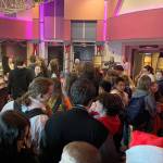 Sequim Gazette photo by Matthew Nash/ Boys & Girls Clubs of the Olympic Peninsula members from Sequim and Port Angeles gather in the lobby of Deer Park Cinema on Dec. 9 for free popcorn and soda provided by Amazon MGM Studios prior to a screening of The Boys in the Boat.