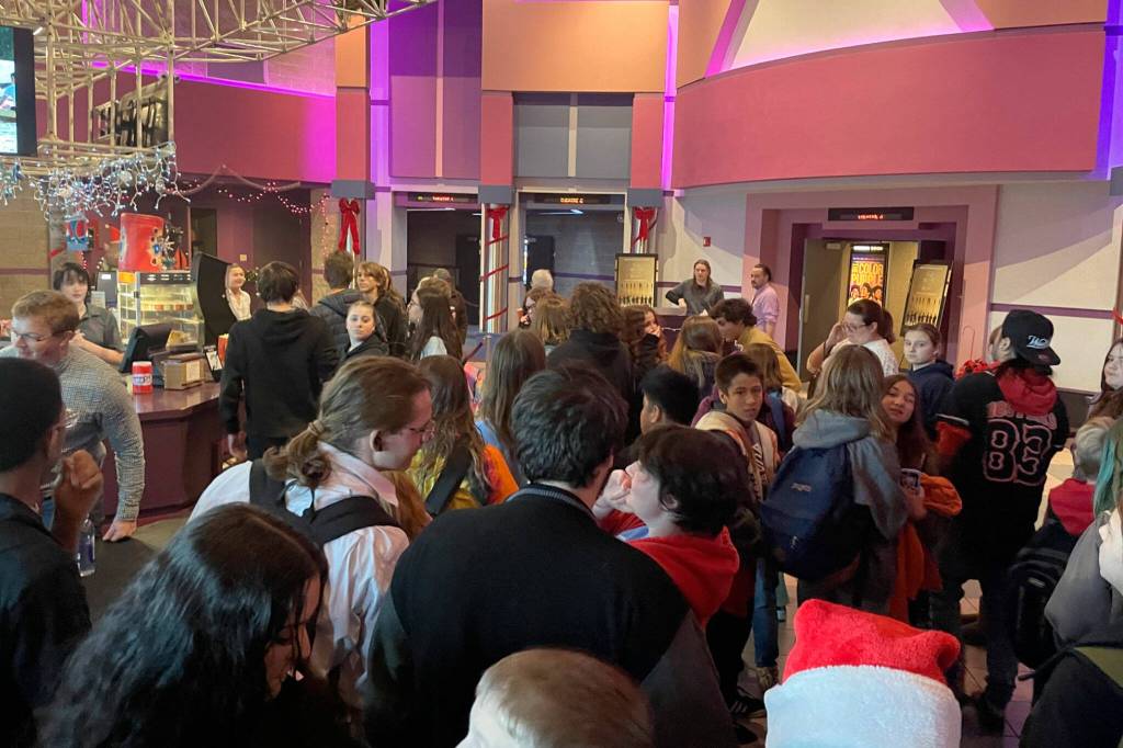Sequim Gazette photo by Matthew Nash/ Boys & Girls Clubs of the Olympic Peninsula members from Sequim and Port Angeles gather in the lobby of Deer Park Cinema on Dec. 9 for free popcorn and soda provided by Amazon MGM Studios prior to a screening of The Boys in the Boat.