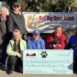 Photo courtesy of Hurricane Ridge Kennel Club
Hurricane Ridge Kennel Club representatives present Welfare for Animals Guild with a $1,500 donation. Pictured, from left, are club members Lydia Samperi and Carolyn Money, club director Rene Fox, club president Lorraine Shore, club treasurer Joe Metz and Mel Marshall, Welfare for Animals Guild director, and her volunteers.