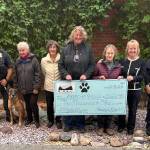 Photo courtesy of Hurricane Ridge Kennel Club / Hurricane Ridge Kennel Club representatives present the Port Angeles Police Department with a $2,000 donation for its K-9 program. Pictured, from left, are club member Joan Ethier, K-9 Sgt. Kevin Miller and K-9 Bodie, club member Carolyn Money, club agility chair Nancy Radich, club vice president Susan Parr, club member Elena Metz, club president Lorraine Shore and Officer Whitney Fairbanks with K-9 Copper. Sergeant Kevin Miller, with his K-9 partner Bodie and Officer Whitney Fairbanks with her K-9 partner Copper, accepted the donation of $2,000.00 from HRKC President Lorraine Shore. L-R: HRKC member Joan Ethier, K9 Sgt. Kevin Miller and K9 Bodie, HRKC Member Carolyn Money, Agility Chair Nancy Radich, HRKC Vice-President Susan Parr, HRKC member Elena Metz, HRKC President Lorraine Shore and Officer Whitney Fairbanks with K9 Copper.