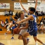 Sequim sophomore Zeke Schmadeke looks to pass from a Bremerton trap along the baseline on Dec. 12.