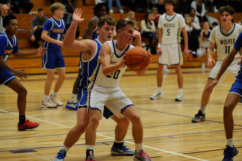 Sequim Gazette photo by Matthew Nash / Sequims Mason Rapleje looks for a play against Bremerton on Dec. 12.