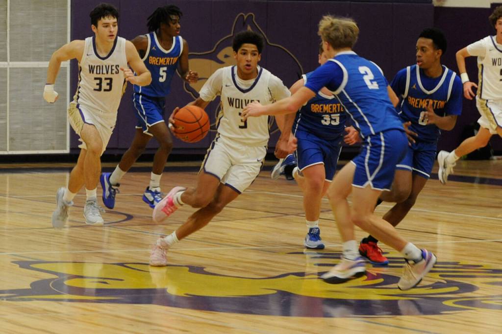 Sequim Gazette photo by Matthew Nash / Solomon Sheppard dribbles past halfcourt against past Bremerton on Dec. 12.