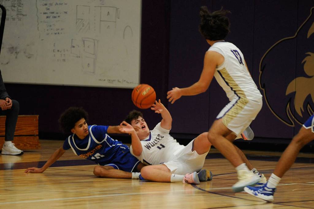 Sequims Keenan Green saves a loose ball to keep the possession with Sequim in a late game moment against Bremerton.