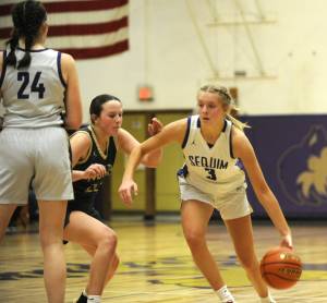Sequims Jolene Vaara, right, drives to the basket in the first half of the Wolves 56-40 win over North Kitsap on Dec. 15.
