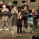 Sequim Gazette photo by Matthew Nash/ Pearle Peterson and members of the Sequim High School Jazz Band sing and play Let it Snow on Dec. 14 for a joint middle and high school band concert.