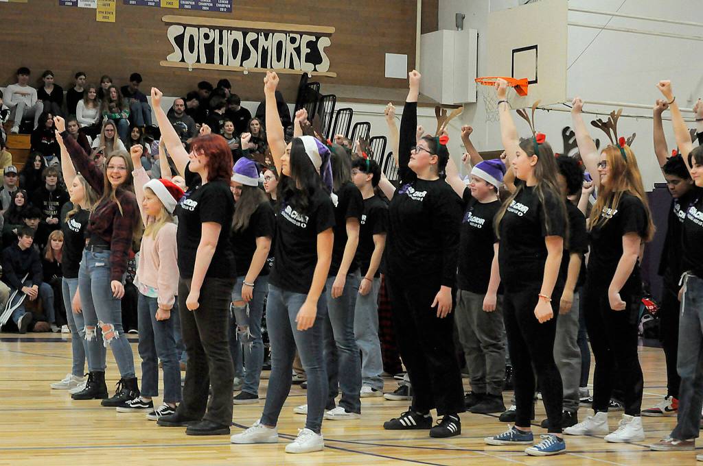 Sequim Gazette photo by Matthew Nash/ Sequim High Schools choir finishes a song with emphasis at the Winter Wishes assembly.