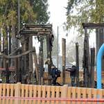 Photo by Keith Thorpe/Olympic Peninsula News Group / Police and fire investigators pour through the rubble of the Dream Playground after it was destroyed by fire in the the early hours on Dec. 20.
