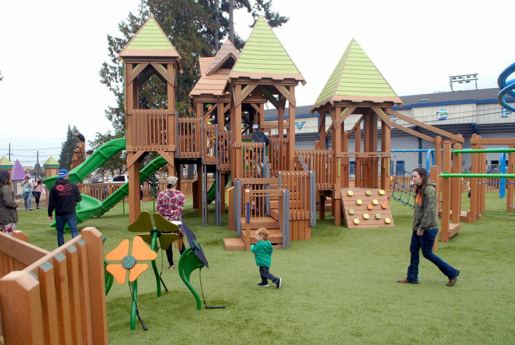 File photo by Keith Thorpe/Olympic Peninsula News Group / Children and parents roam through the Generation II Dream Playground at Erickson Playfield in Port Angeles on its dedication day in September 2021.