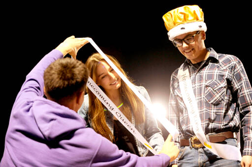 Sequim High School Homecoming Queen Taryn Johnson, left, receives a sash at Friday nights football game while king Sage Younger looks on. Sequim shut out North Mason 36-0. (Michael Dashiell/Olympic Peninsula News Group)
