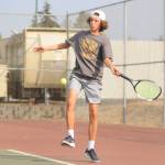 Sequim Gazette photo by Michael Dashiell / Sequim's Garrett Little returns a shot as he takes on North Kitsap's Indigo Gallagher-Zapf in No. 1 singles play on Sept. 13.
