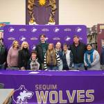 Sequim Gazette photo by Michael Dashiell / Sequim High senior Garrett Little (seated) is joined by friends and family at a letter-of-intent signing ceremony on Dec. 22 at the SHS library. Little amassed an undefeated league record, three league titles, a district title and two to-three finishes (so far) at state tournaments, and plans to play at Westmont College in Santa Barbara, Calif., after graduation.