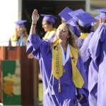 Sequim Gazette photo by Michael Dashiell
Right: Hiilei Robinson offers a parting wave as she and fellow Sequim High seniors accept diplomas at the schools graduation ceremony on June 16.