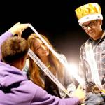 Sequim Gazette photo by Michael Dashiell/ Sequim High School Homecoming Queen Taryn Johnson, left, receives a sash at Friday nights football game while king Sage Younger looks on. Sequim shut out North Mason 36-0.