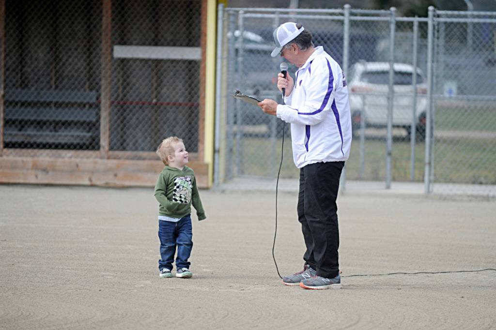 Sequim Gazette photo by Matthew Nash/ Kamden Owens, 3, greets Stephen Rosales during a ceremony renaming a field the Kayla Owens Field at the James Standard Park to honor Kamdens mom in March.