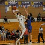 Sequim Gazette photos by Michael Dashiell
Sequims Solomon Sheppard, left, drives to the basket in the first half of the Wolves 70-56 home win over North Mason on Jan. 2. Defending the play is North Masons Cameron Revelez.