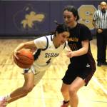 Sequim Gazette photo by Michael Dashiell / Sequims Gracie Chartraaw, left, tries to get past Kingstons Tavyn Belgarde in the Wolves 51-41 win on Jan. 5.