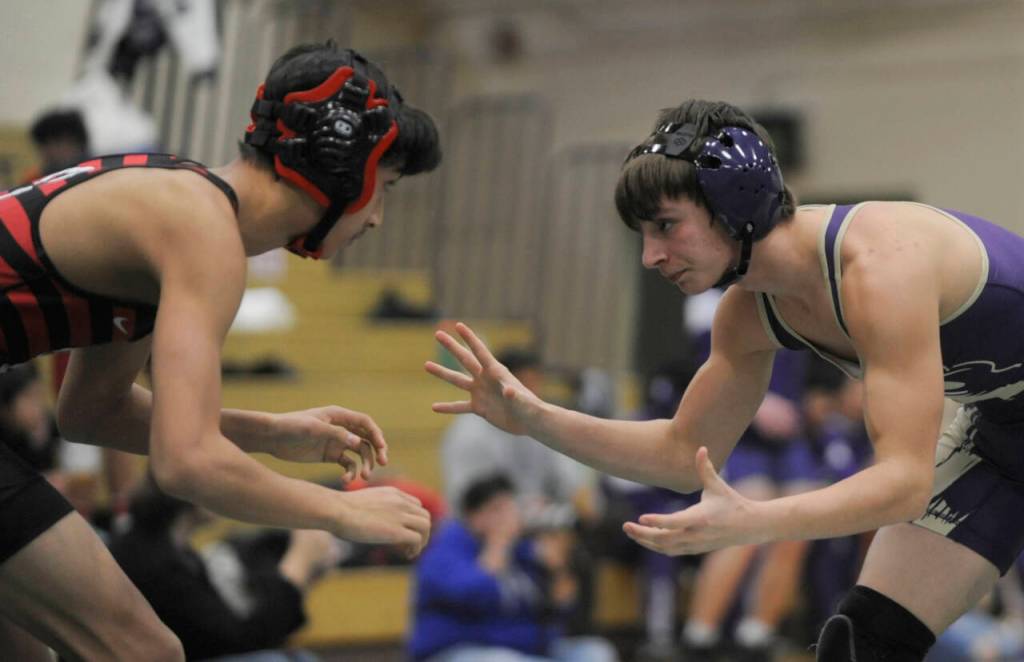 Sequim Gazette photo by Michael Dashiell / Sequims Cayden Beauregard, right, squares off against Khailan Chan of Camas at the Battle of the Axe tournament in Port Angeles on Jan. 6. Beauregard earned one of his three pins on the tournament against Chan, in 4:26.