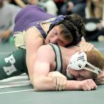 Photo by Keith Thorpe/Olympic Peninsula News Group / Sequims James Smith, top, takes on Port Angeles Ronan McGuire in the 157-pound weight class at the Battle of the Axe in Port Angeles on Jan. 6.