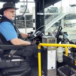 Clallam Transit driver Duane Benedict looks down at his fare box before departing The Gateway transit center in downtown Port Angeles on Saturday — the last day of collecting fares on most bus routes. (Keith Thorpe/Peninsula Daily News)