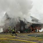 Sequim Gazette photo by Matthew Nash
Both Clallam County Fire District 2 and 3 sent firefighters to a barn fire up Blue Mountain Road on Jan. 8. No injuries were reported but several vehicles were damaged, fire officials report.