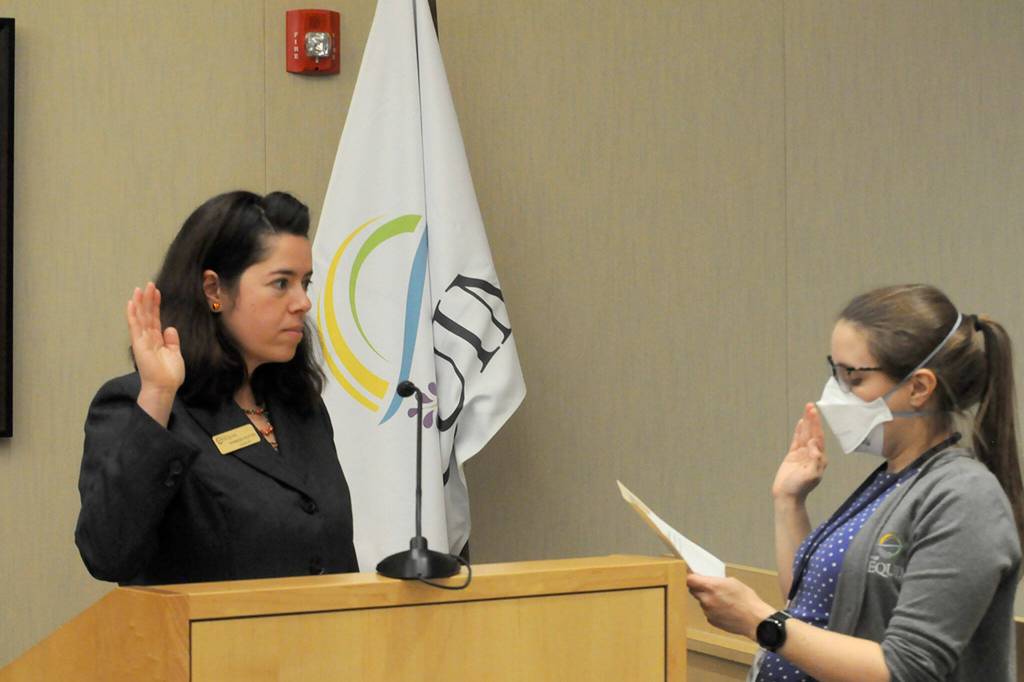 Sequim Gazette photo by Matthew Nash/ Harmony Rutter takes her oath office from city clerk Amy Aschenbrenner for Sequim city council seat No. 6 on Jan. 8 in the council chambers.