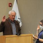 Sequim Gazette photo by Matthew Nash/ Tom Ferrell takes his oath office from city clerk Amy Aschenbrenner for Sequim city council seat No. 7 on Jan. 8 in the council chambers.