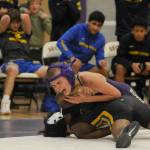 Sequim Gazette photo by Michael Dashiell
Sequims Brandon Bair, top, grapples with Bremertons Makhi Marion at 106 pounds. Bairs come-from-behind pin in the matchs final round helped Sequim win by five points.