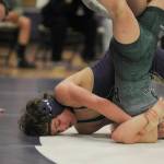 Sequim Gazette photo by Michael Dashiell / Sequims Ryan Spelker, left, works to pin Port Angeles Faye Dachs in the 120-pound weight class in an Olympic League match in Sequim on Jan. 10.