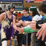 Sequim Gazette photo by Michael Dashiell / Sequims Jayms Vilona gets congratulated by teammates after a win over his Bremerton foe on Jan. 10.