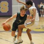 Sequim Gazette photo by Michael Dashiell / Sequims Solomon Sheppard, right, pressures Gus Halberg in the first half of a Jan. 11 Olympic League match-up.