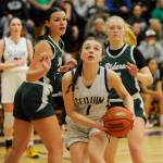 Sequim Gazette photo by Michael Dashiell
Sequims Taylor Heyting, center, looks to score as Port Angeles defenders Lexie Smith, left, and Paige Mason look on. PAs Roughriders upended the host Wolves 66-64 on Jan. 11.