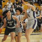 Sequim Gazette photo by Michael Dashiell / Lindsay Smith of Port Angeles, left, looks for an open teammate as Sequims Bobbi Mixon, center, and Dani Herman defend the play.