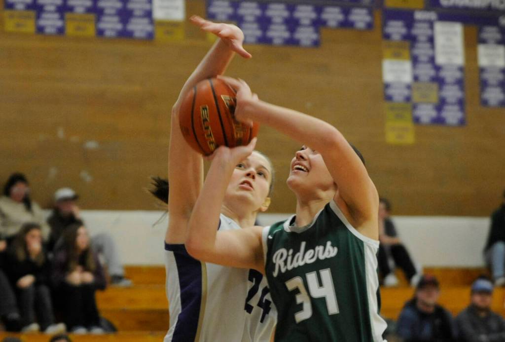 Sequim Gazette photo by Michael Dashiell
Sequims Dani Herman, left, blocks a shot attempt by Port Angeles Lexie Smith in a Jan. 11 Olympic League match-up in Sequim.