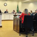 Photo by Aspen Anderson/Washington State Journal / Testifying on Jan 8 in favor of a bill to stop deception in interrogations are, from left: Lara Zarowsky, the Executive Director of the Washington Innocence Project; Ted Bradford, the first person in Washington state to be exonerated by DNA evidence, and Amanda Knox, a victim of false conviction. All testified in favor of HB1062.