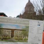 Photo by Aspen Anderson/Washington State Journal / A sign shows what the new Newhouse building will look like.
