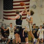 Sequim Gazette photo by Michael Dashiell / Sequims Zeke Schamdeke, right, deflects a Bainbridge pass to teammate Mason Rapelje, left, in a Jan. 20 league match-up against the Bainbridge Spartans.