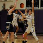 Sequim Gazette photo by Michael Dashiell / Sequims Charlie Grider, right, guards the basket agains Bainbridges Evan Burke in the Wolves loss to the 3A Spartans on Jan. 20.