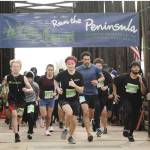 Nearly 300 runners take off in the Run the Peninsula's Sequim Railroad Bridge run Saturday morning. (Michael Dashiell/Olympic Peninsula News Group)