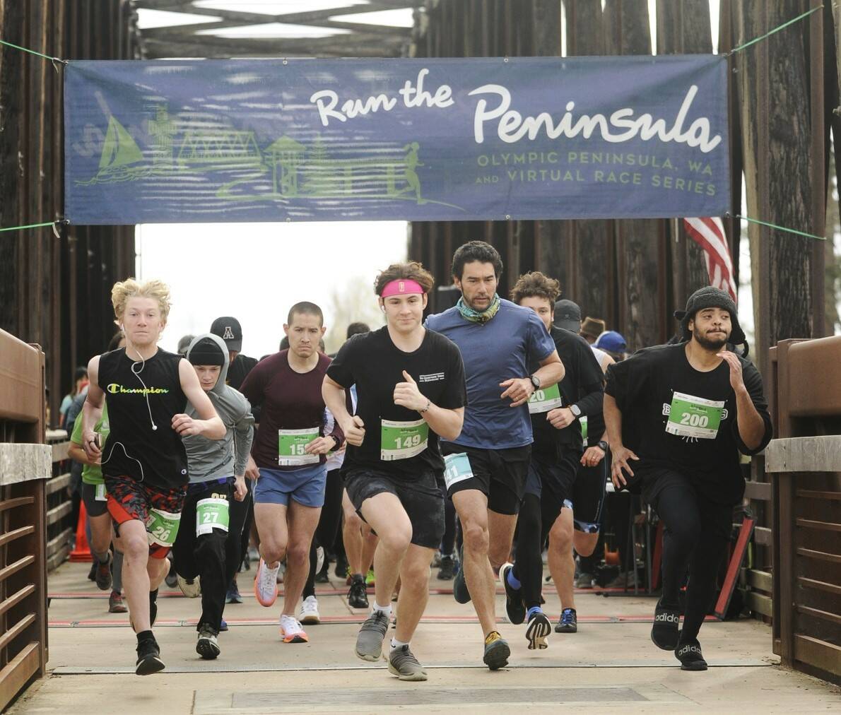 Sequim Gazette file photo by Michael Dashiell / About 300 runners take off in the Run the Peninsulas Sequim Railroad Bridge run in April 2023.