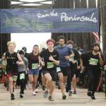 Sequim Gazette file photo by Michael Dashiell / About 300 runners take off in the Run the Peninsulas Sequim Railroad Bridge run in April 2023.