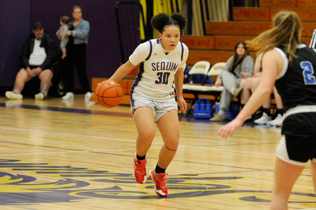 Sequim Gazette photo by Matthew Nash/ Bobbi Mixon brings the ball up on Jan. 26 against North Mason.