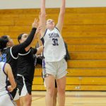 Sequim Gazette photo by Matthew Nash/ Hailey Wagner snags a rebound over North Mason players on Jan. 26.