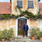 Photo courtesy of Steve Nordwell / Anton Blašič stands outside the home of Frančišec Blašič, his father and an eyewitness to the 1944 B-24 crash.