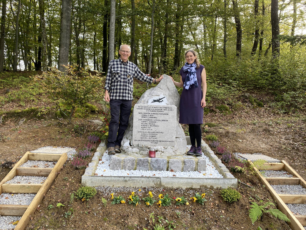 Photo courtesy of Steve Nordwell 
Steve Nordwell and daughter Hillary stand in Stravberk, Slovenia, near a monument to the crew of B-24 that was shot down in Nazi-occupied territory in March 1944. The bomber was ninckmnamed Moo Juice.