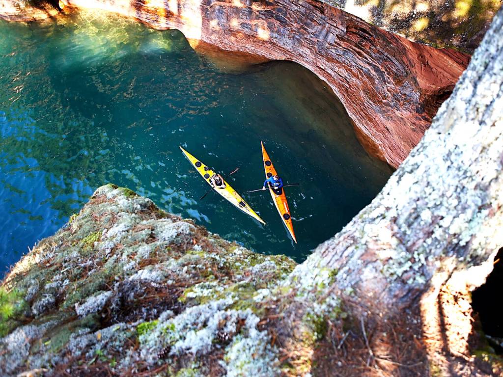 Photo courtesy of Gail Green and Grant Herman / Hiking among the cliffs on the Apostle Islands.