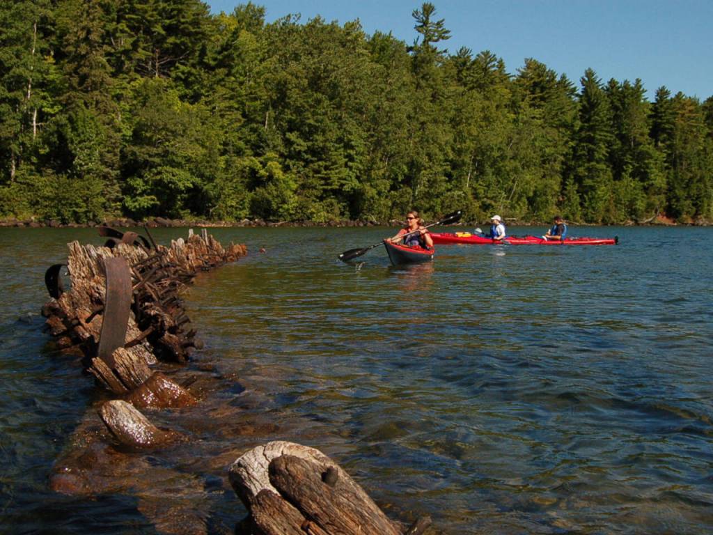 Photo courtesy of Gail Green and Grant Herman / Kayakers explore the shipwrecked remains of the Fedora, a 282-foot-long bulk carrier that sank in 1901 in Lake Superior.